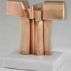 Bronze abstract sculpture on a white marble base