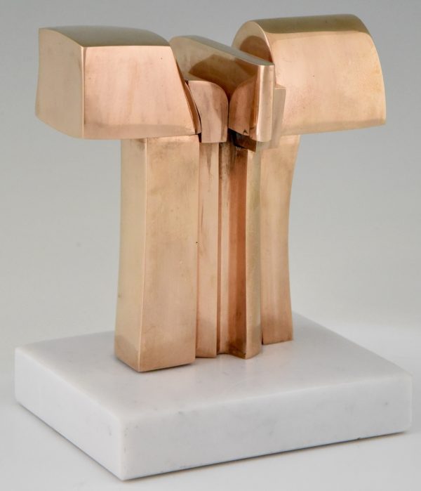 Bronze abstract sculpture on a white marble base