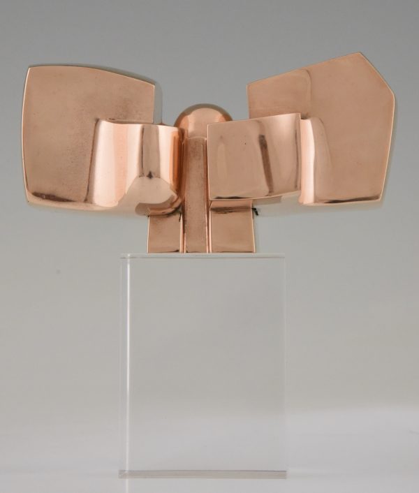 Bronze abstract sculpture on plexiglass base.