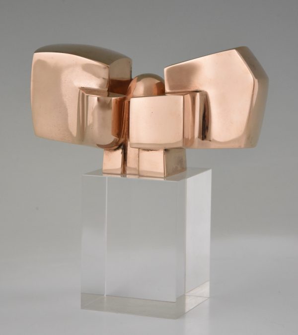 Bronze abstract sculpture on plexiglass base.