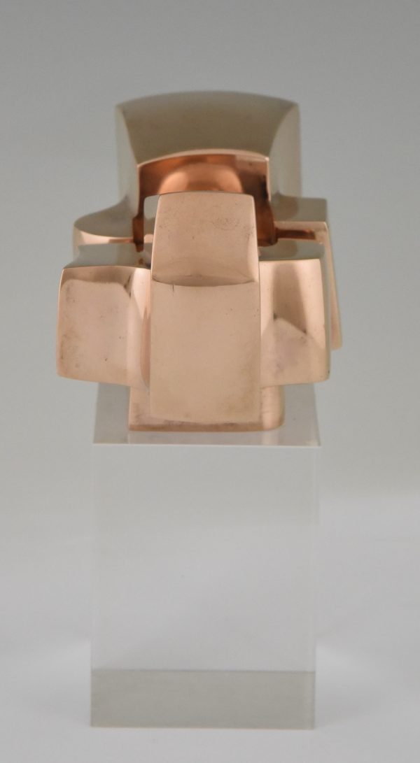 Bronze abstract sculpture on plexiglass base.