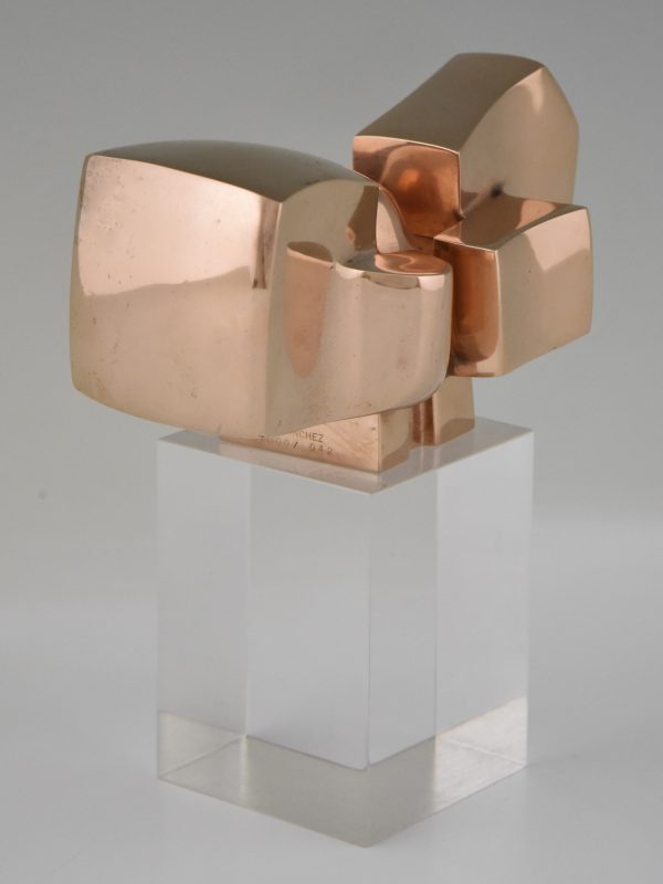 Bronze abstract sculpture on plexiglass base.