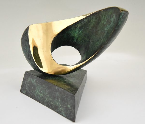 Abstract bronze oval shaped sculpture.