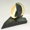 Abstract bronze oval shaped sculpture.