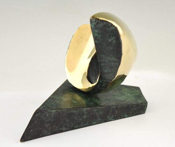 Abstract bronze oval shaped sculpture.