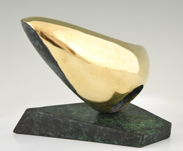 Abstract bronze oval shaped sculpture.