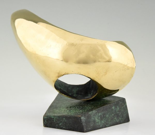 Abstract bronze oval shaped sculpture.