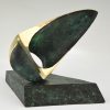 Abstract bronze oval shaped sculpture.