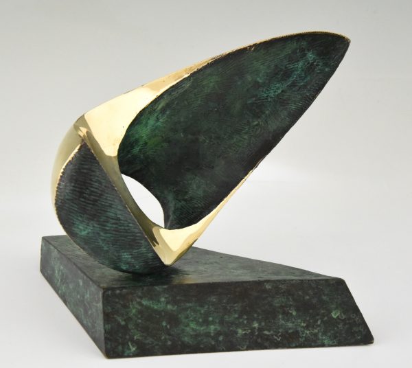 Abstract bronze oval shaped sculpture.