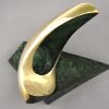 Abstract bronze oval shaped sculpture.