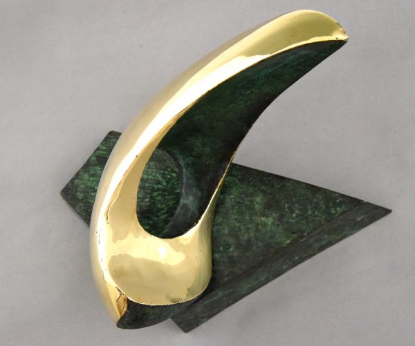 Abstract bronze oval shaped sculpture.