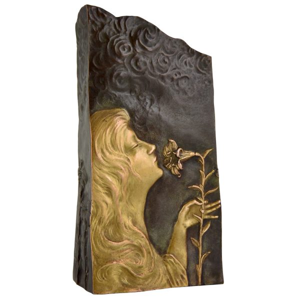 Art Nouveau bronze vase with woman’s face and flowers