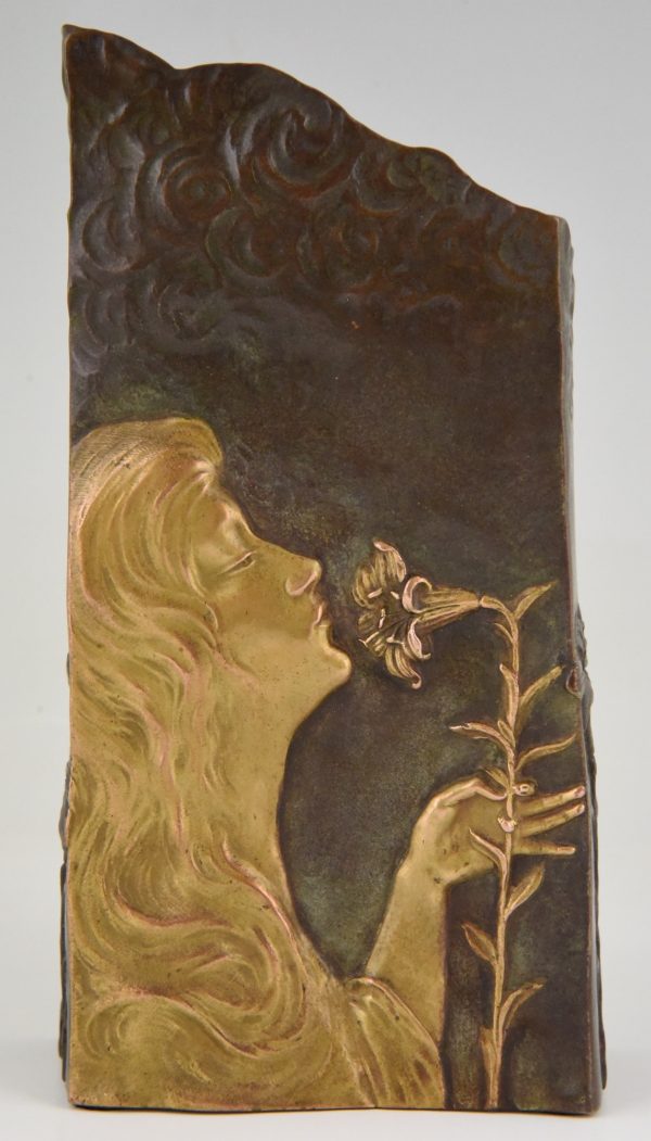 Art Nouveau bronze vase with woman’s face and flowers