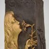 Art Nouveau bronze vase with woman’s face and flowers