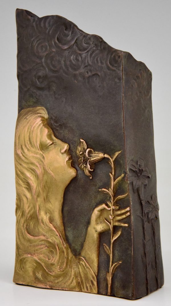 Art Nouveau bronze vase with woman’s face and flowers