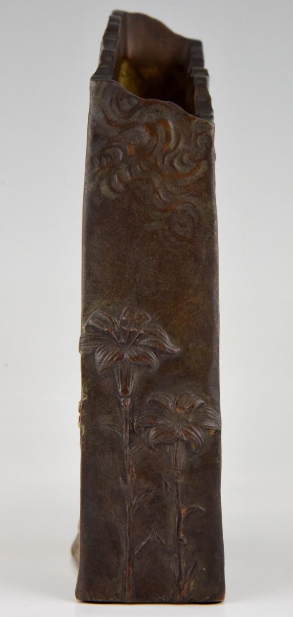 Art Nouveau bronze vase with woman’s face and flowers