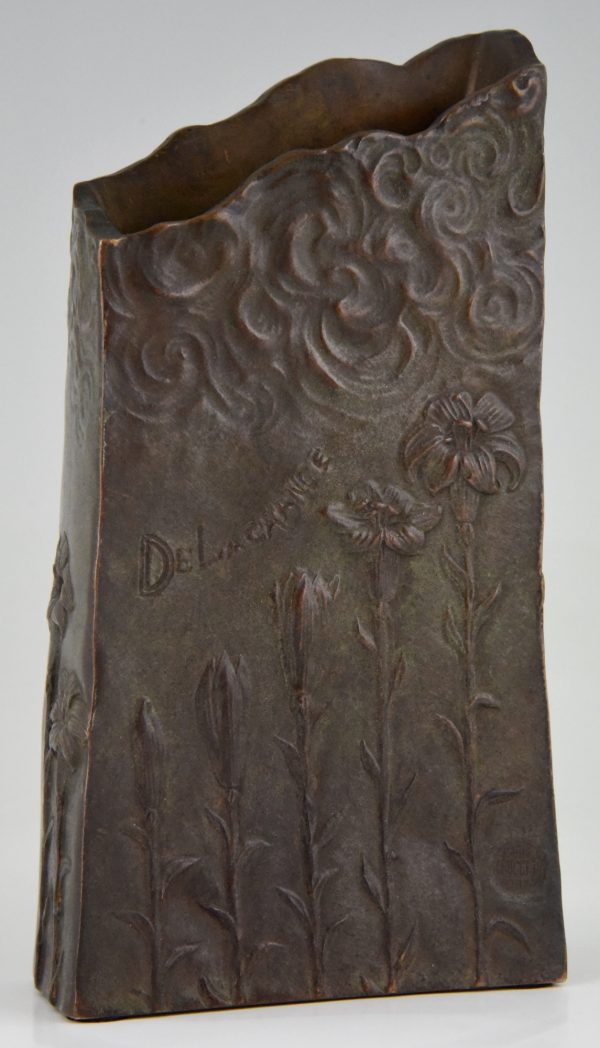 Art Nouveau bronze vase with woman’s face and flowers