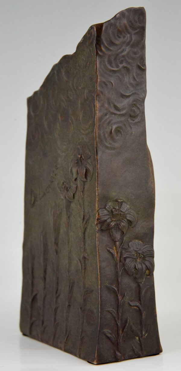 Art Nouveau bronze vase with woman’s face and flowers