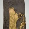 Art Nouveau bronze vase with woman’s face and flowers