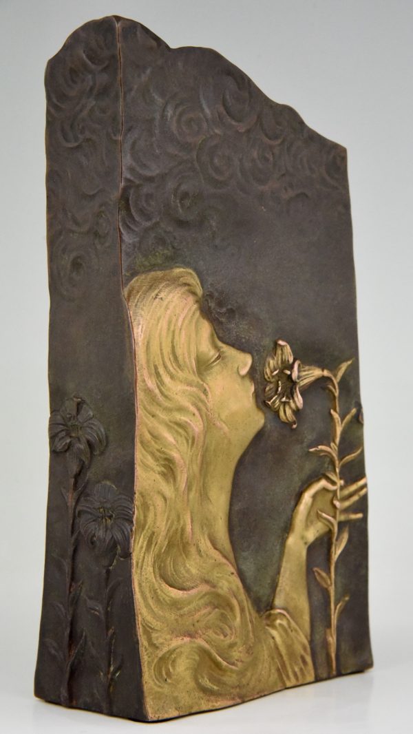 Art Nouveau bronze vase with woman’s face and flowers