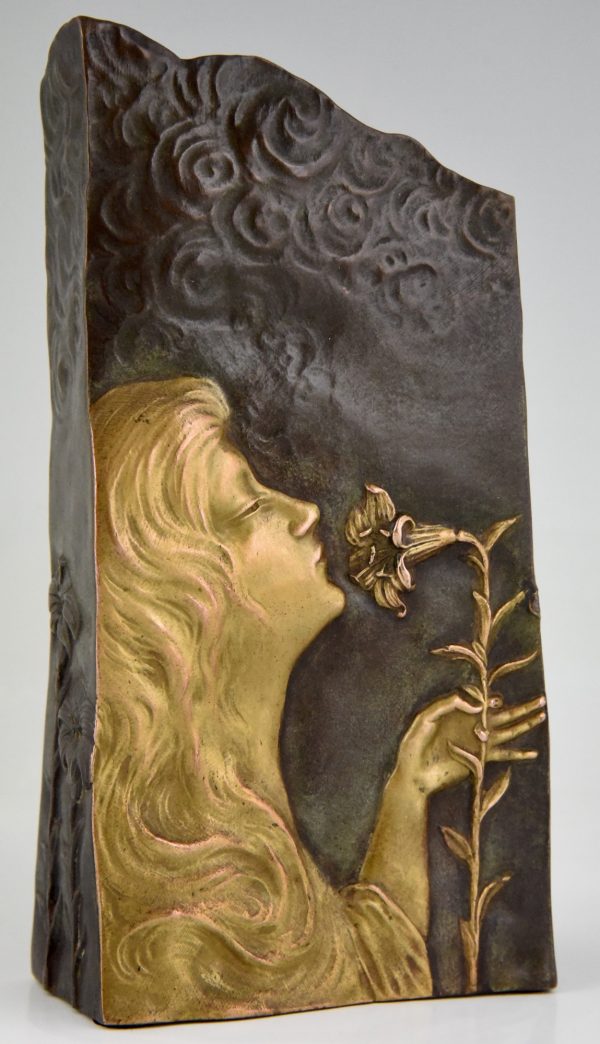 Art Nouveau bronze vase with woman’s face and flowers