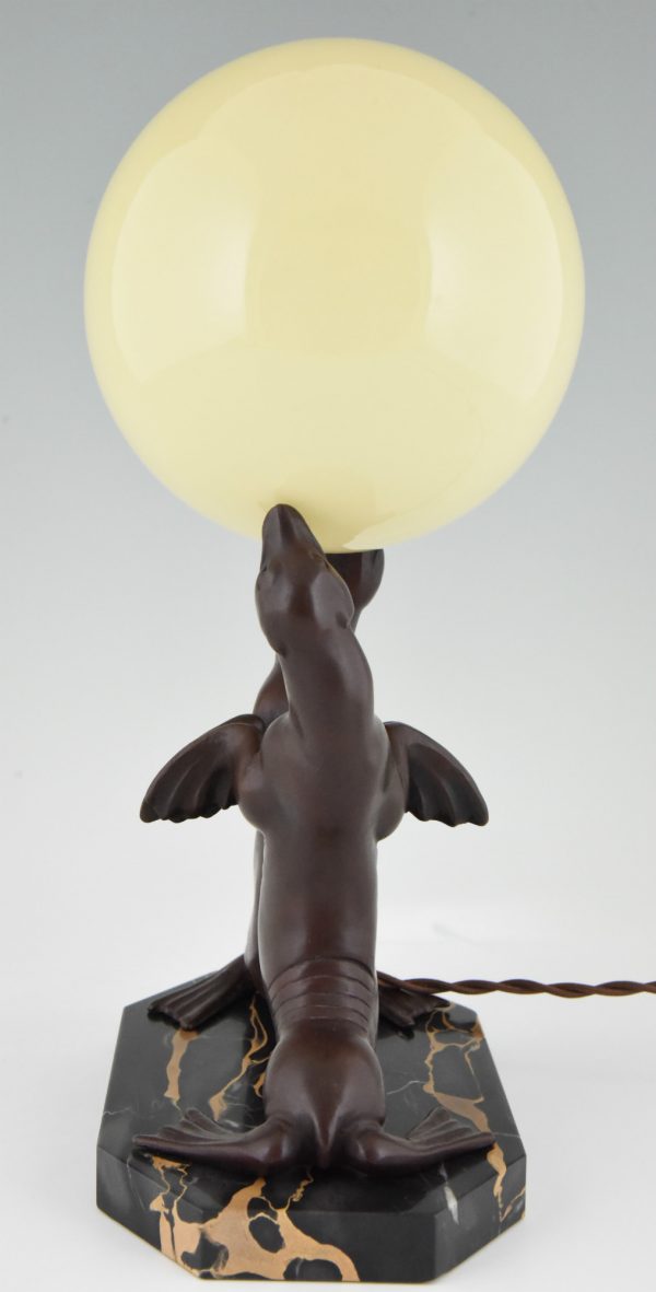 Art Deco lamp of two seal playing with a ball