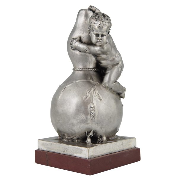 Bronze sculpture of a baby boy on a vase with mice.