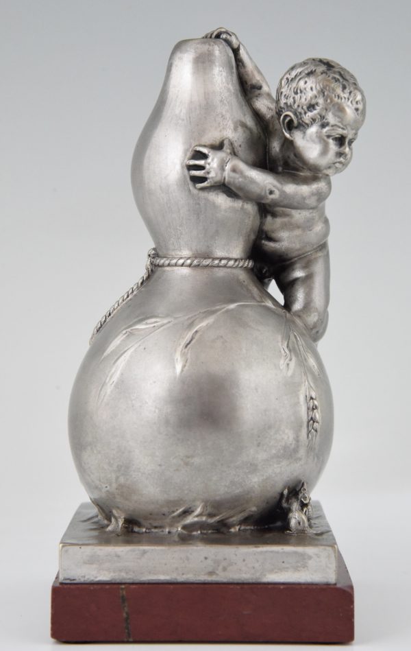 Bronze sculpture of a baby boy on a vase with mice.