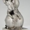 Bronze sculpture of a baby boy on a vase with mice.