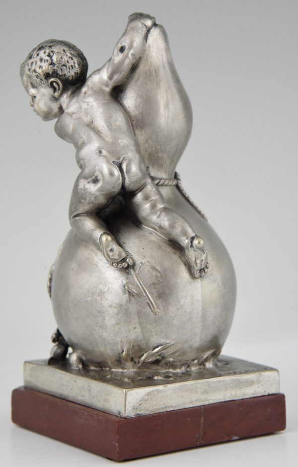 Bronze sculpture of a baby boy on a vase with mice.