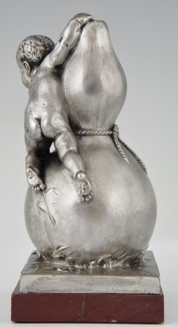 Bronze sculpture of a baby boy on a vase with mice.