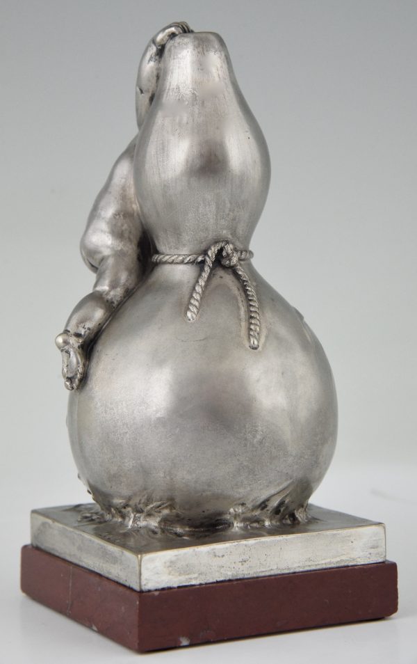 Bronze sculpture of a baby boy on a vase with mice.