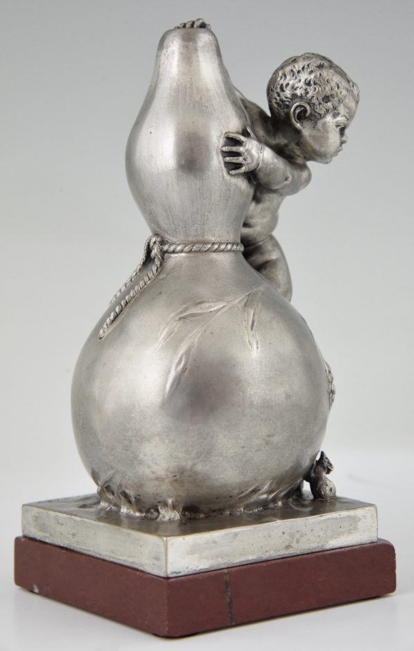 Bronze sculpture of a baby boy on a vase with mice.