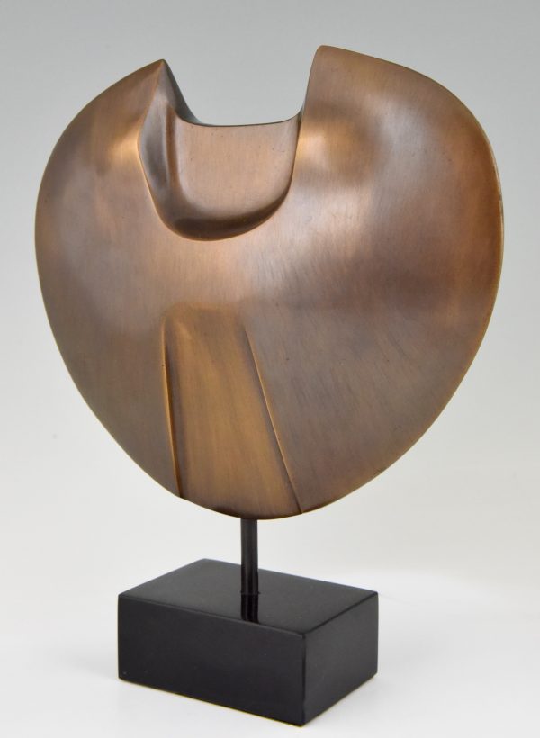 Abstract bronze sculpture on marble base