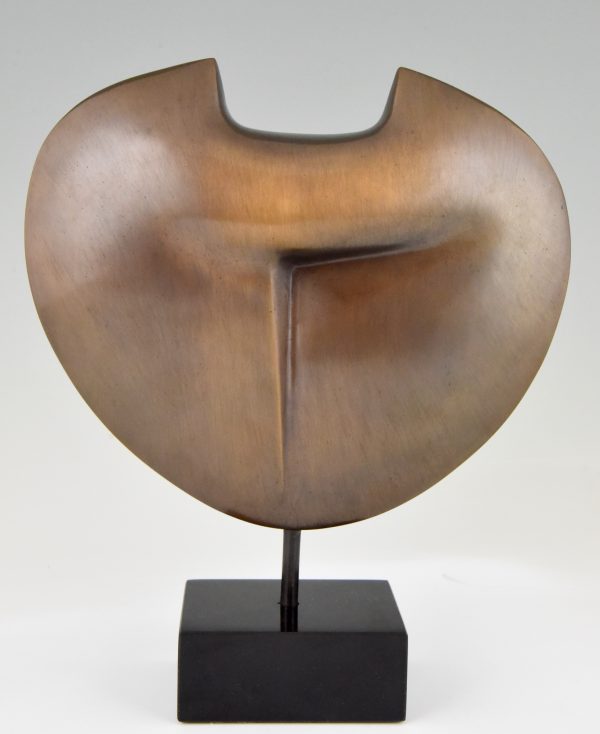 Abstract bronze sculpture on marble base