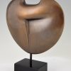 Abstract bronze sculpture on marble base