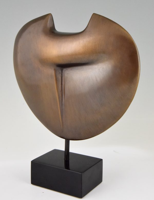 Abstract bronze sculpture on marble base