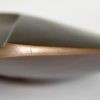 Abstract bronze sculpture on marble base
