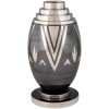 Art Deco Dinanderie vase with stylized geometric design.