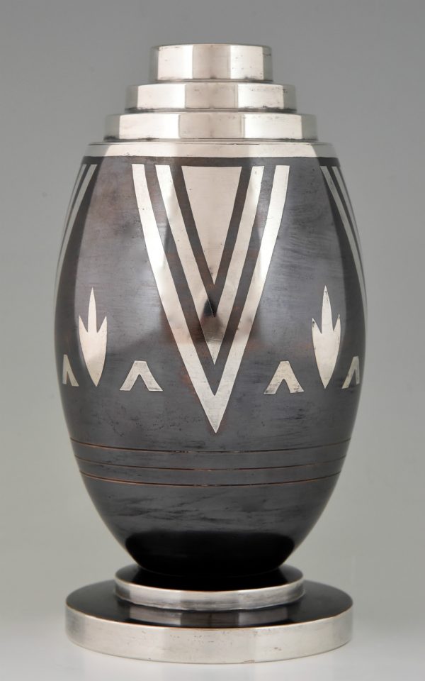 Art Deco Dinanderie vase with stylized geometric design.