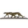 Art Deco sculpture of two walking panthers.