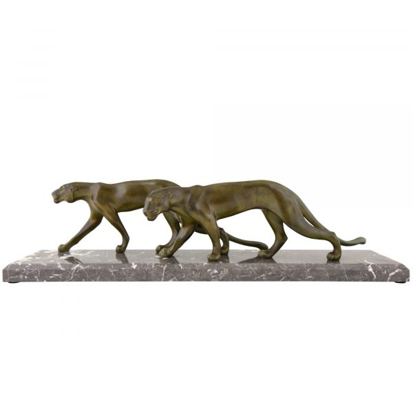 Art Deco sculpture of two walking panthers.