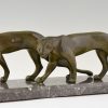 Art Deco sculpture of two walking panthers.