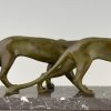 Art Deco sculpture of two walking panthers.