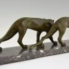 Art Deco sculpture of two walking panthers.