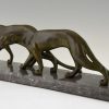 Art Deco sculpture of two walking panthers.