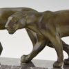 Art Deco sculpture of two walking panthers.