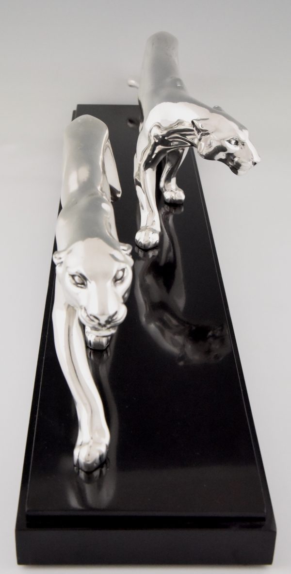 Art Deco silvered sculpture of two panthers