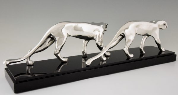 Art Deco silvered sculpture of two panthers