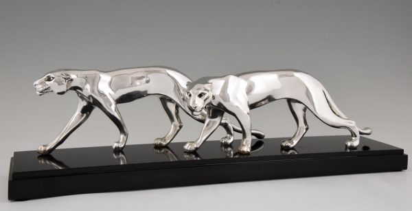 Art Deco silvered sculpture of two panthers.